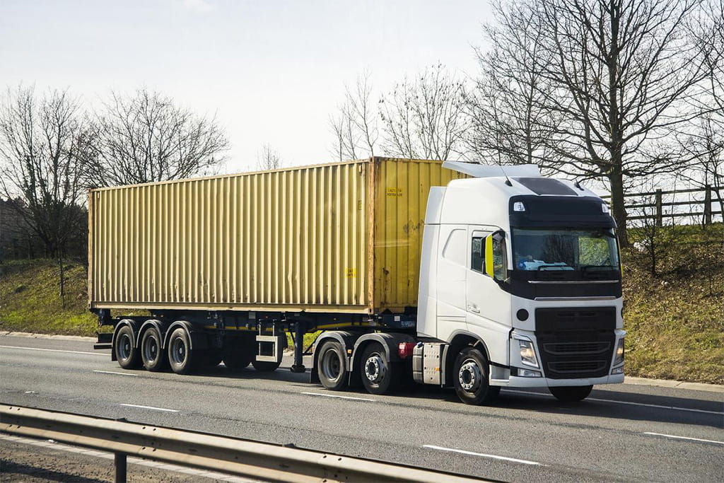 Cargo truck used for land transportation, delivering goods through road logistics networks.