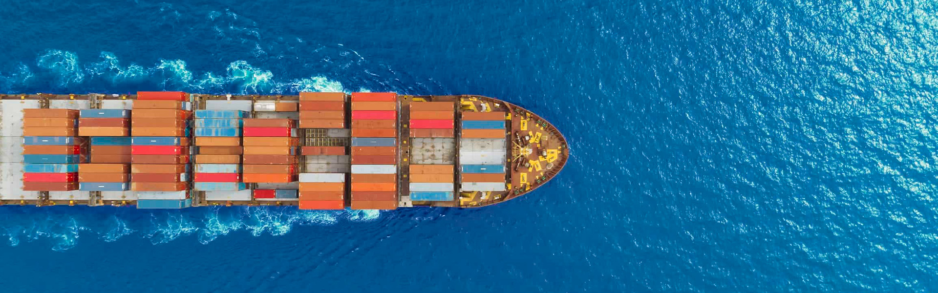 Overseas container shipping for indoor playground equipment, cargo ship transporting amusement park equipment by sea.