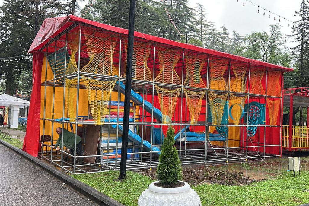 Customer's installed playground in Georgia: the finished 80㎡ indoor-outdoor play equipment with rain canopy, ready for children to use