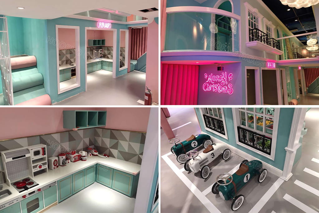 Role-play area in a custom indoor playground featuring a kids' kitchen, themed playhouses, and ride-on cars, showing how additional attractions can increase the overall indoor playground cost.