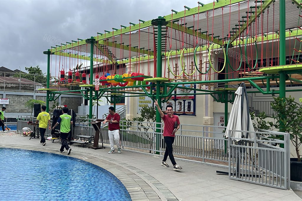 Hooplo Rides outdoor high rope challenge course installation case from Indonesia client, customized outdoor kids adventure rope playground beside swimming pool, finished site feedback photo